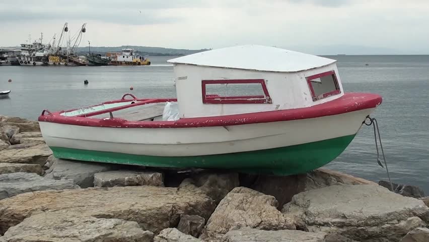 rock the boat a hat in time dry boat on rocks under clouds stock footage video 4137085 rock the boat a hat in time dry boat on rocks under clouds stock footage video 4137085