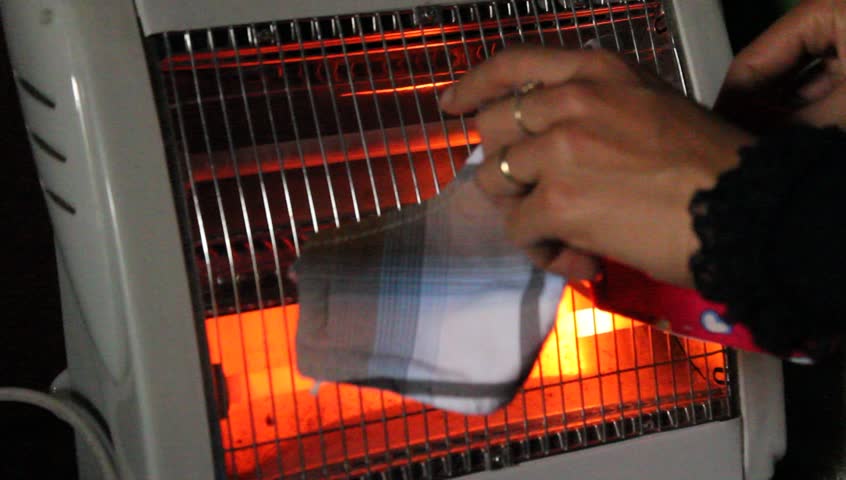 drying-clothes-by-heater-electric-stock-footage-video-5842334