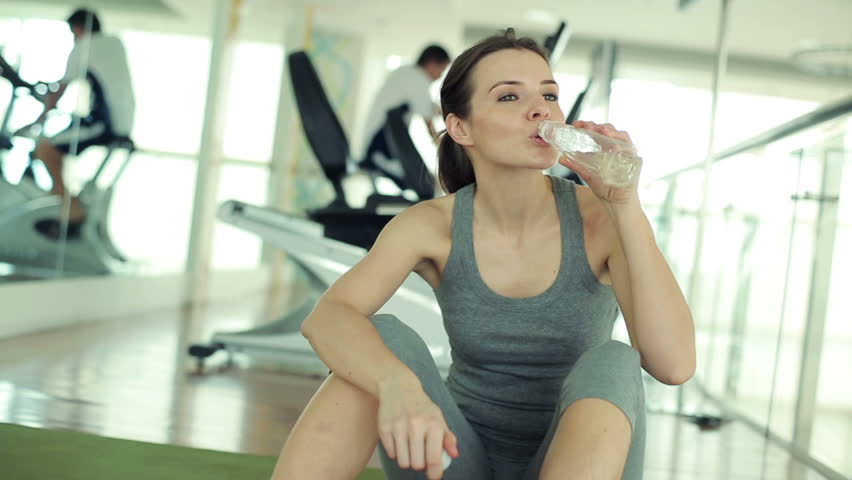 Sweaty Woman Drinking Water After A Workout Stock Footage Video 129292