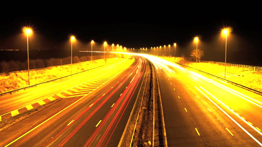 Uk Motorway Time-lapse As The Cars Go Driving Past In Both Directions ...