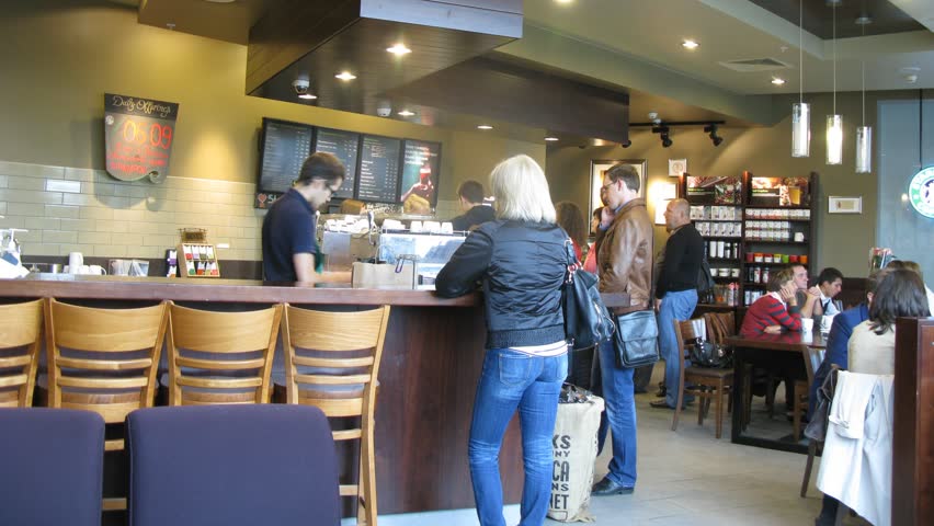 MOSCOW - SEP 1: (Timelapse View) People sit in coffee house Starbucks ...