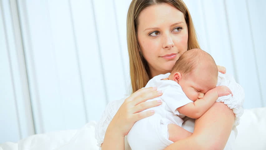 Newborn Caucasian Baby Being Held By His Young Mother Stock Footage ...