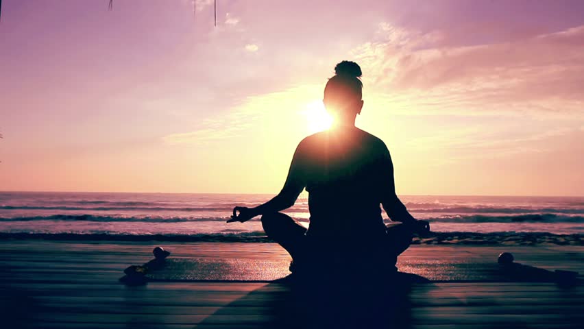 Meditation Near The Sea & Doing Yoga On A Beach At Sunrise Stock ...