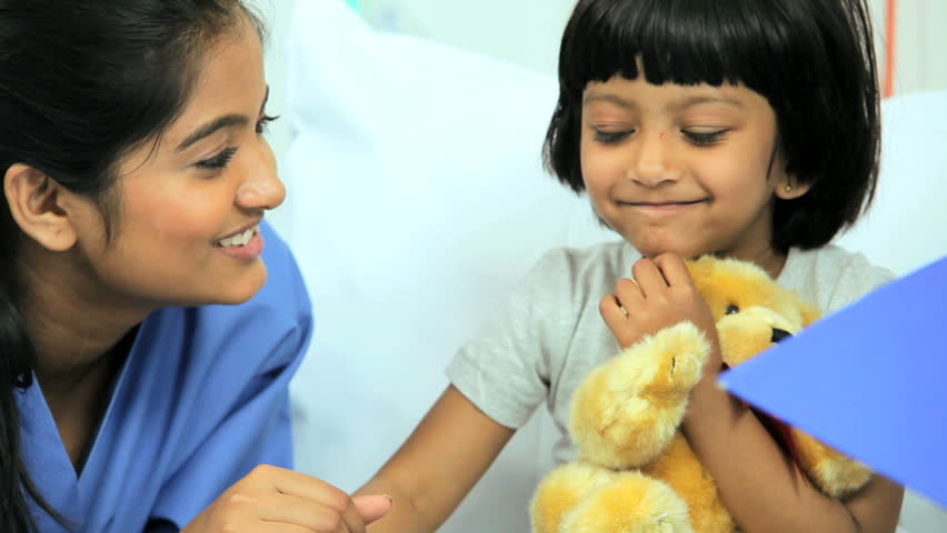 Little Girl Hugging Teddy Bear During Visit From Mother At Children's ...