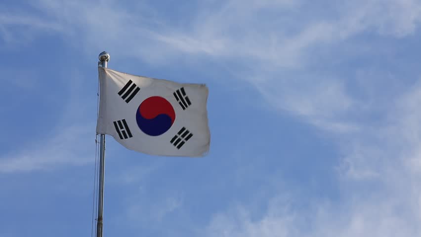 Korea Republic National Flag Waving On Flagpole On Blue Sky Background ...